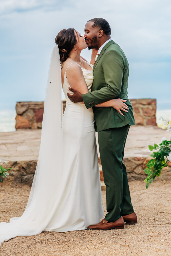 Boulder Wedding Photographer captures bride and groom kissing after ceremony
