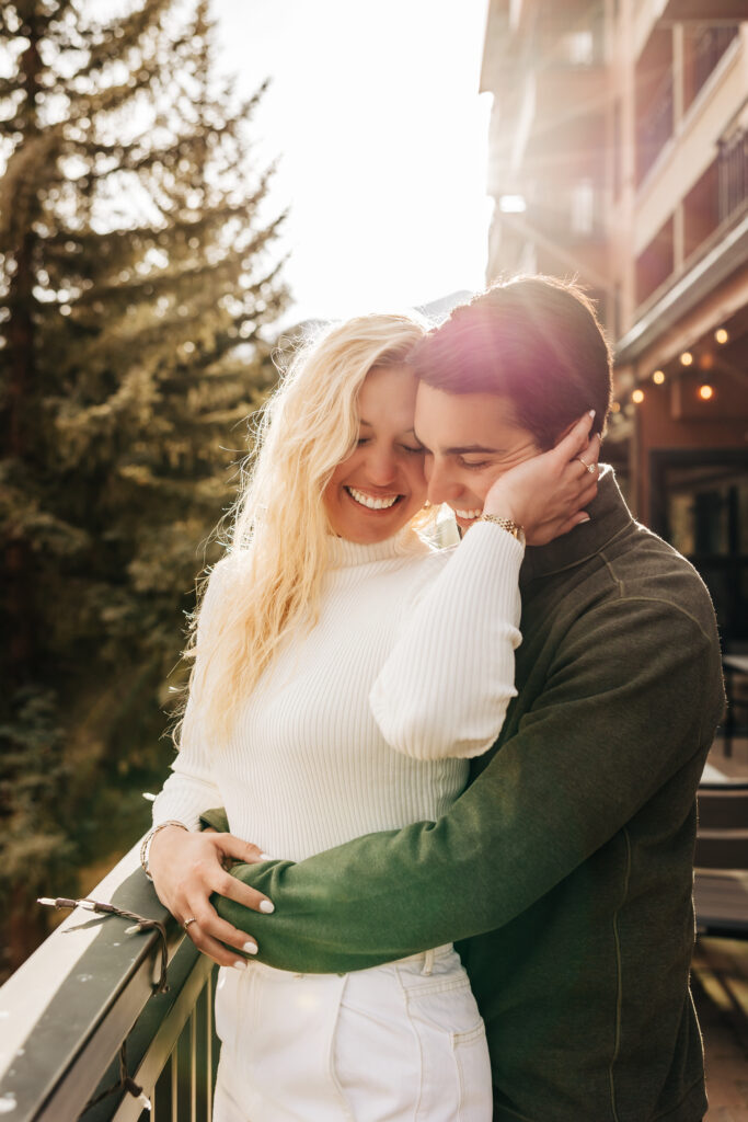 Denver wedding photographer captures woman holding man's face and smiling