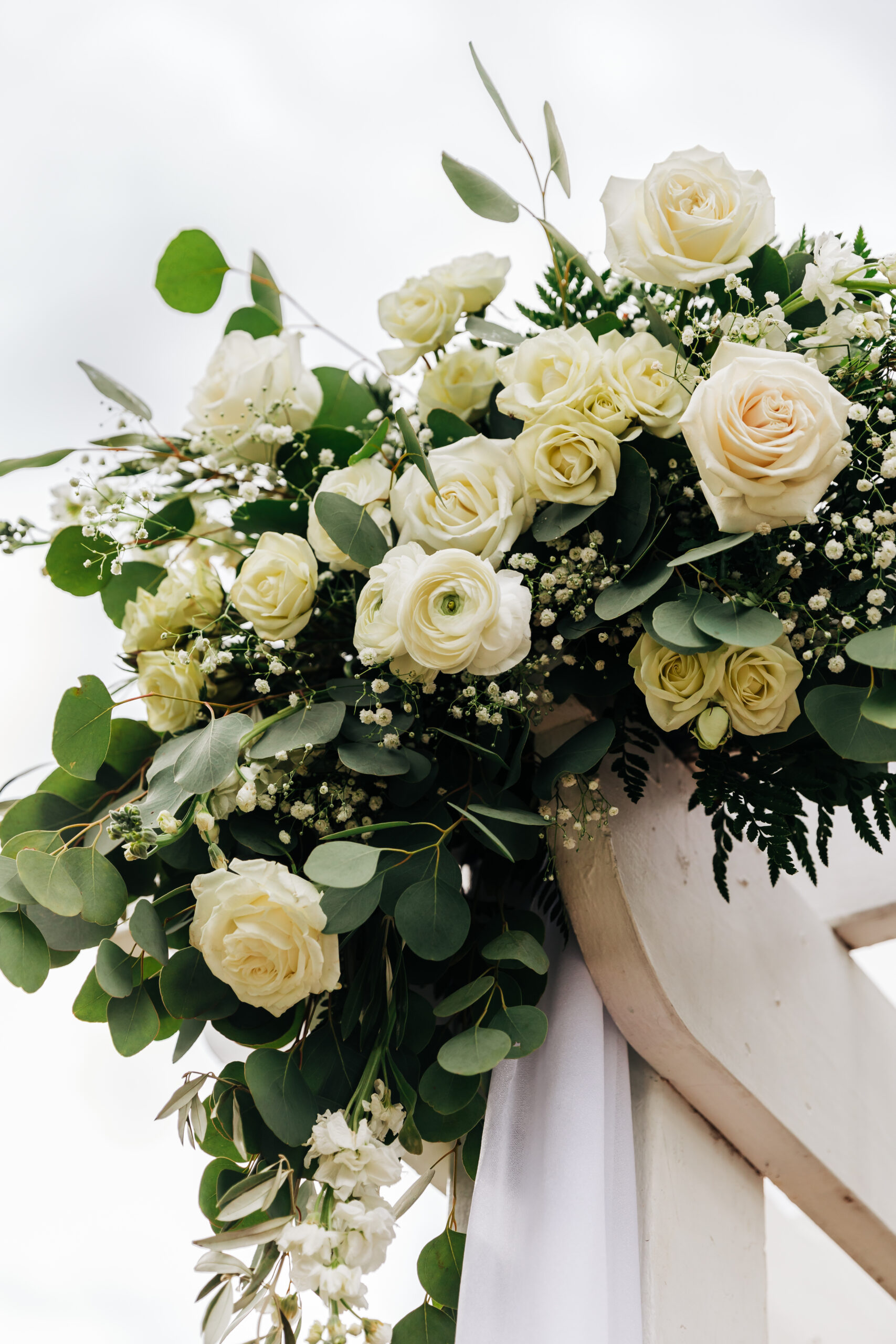 Colorado Elopement Photographer captures flowers on top of wedding arch