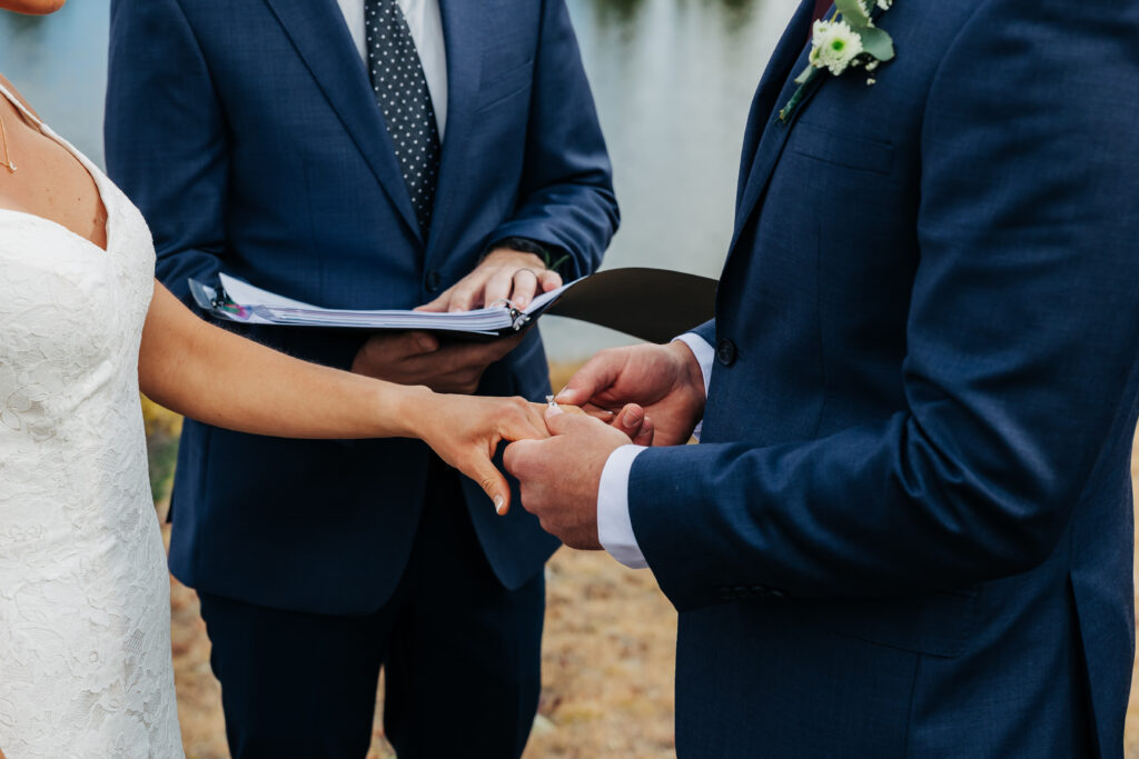 Colorado Elopement Photographer captures groom putting ring on bride