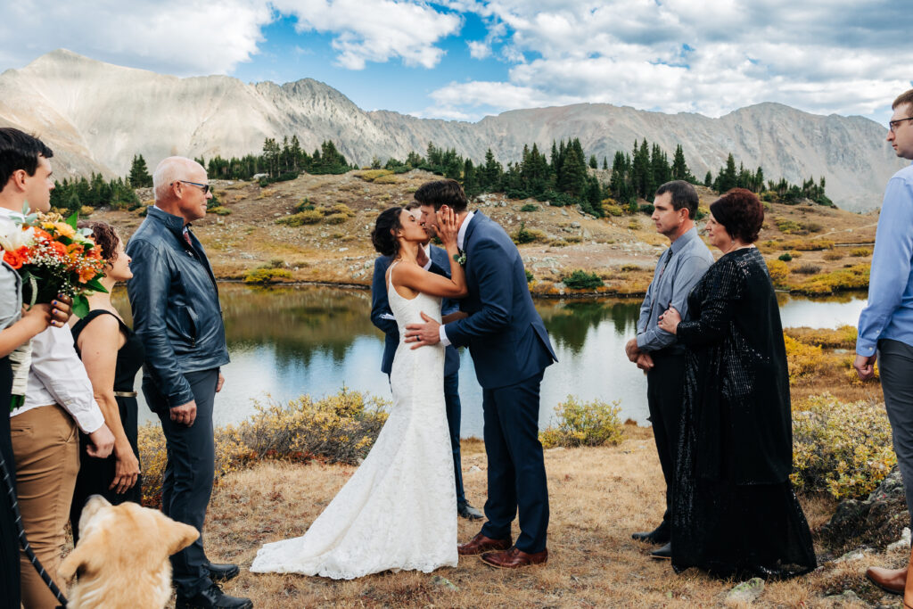 Colorado Elopement Photographer captures bride and groom kissing during ceremony