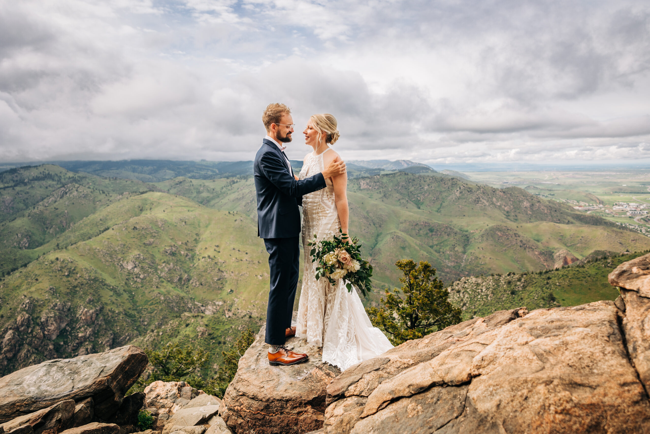 Colorado Elopement Photographer captures bride and groom on boulder during bridals