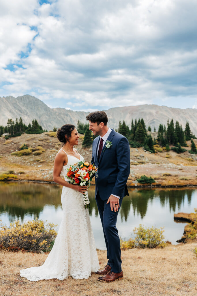 Colorado Elopement Photographer captures bride and groom looking at one another