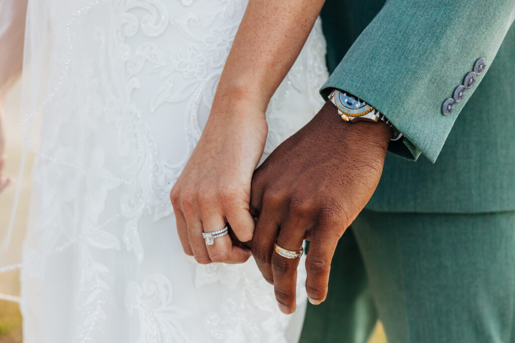Colorado elopement photographer captures bride and groom with interlacing pinkies