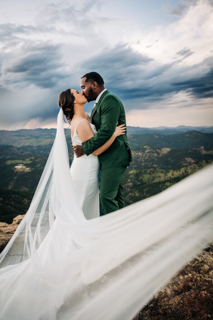 Colorado Elopement Photographer captures bride kissing groom