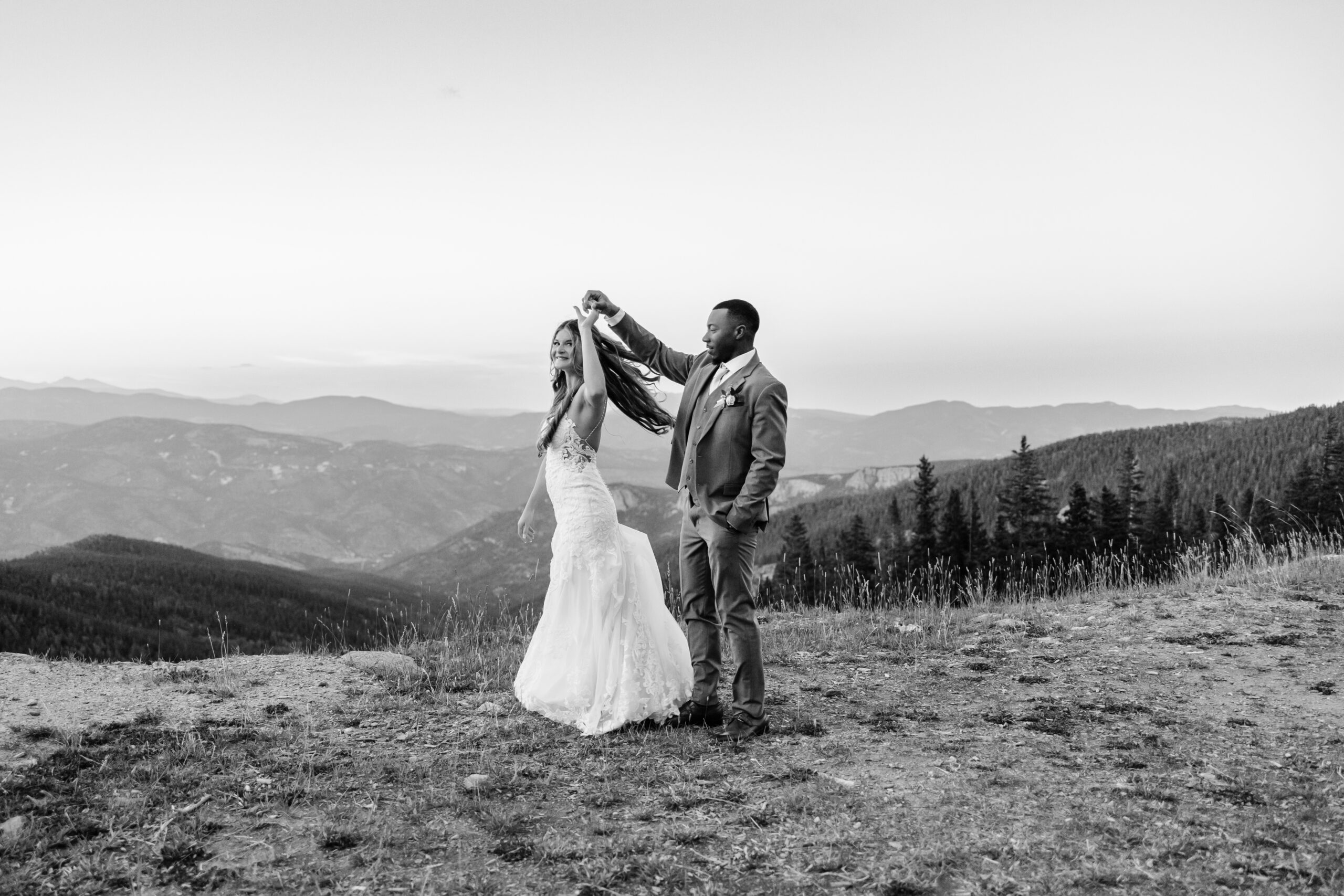 Boulder Elopement Photographer captures groom spinning bride during bridal portraits after eloping