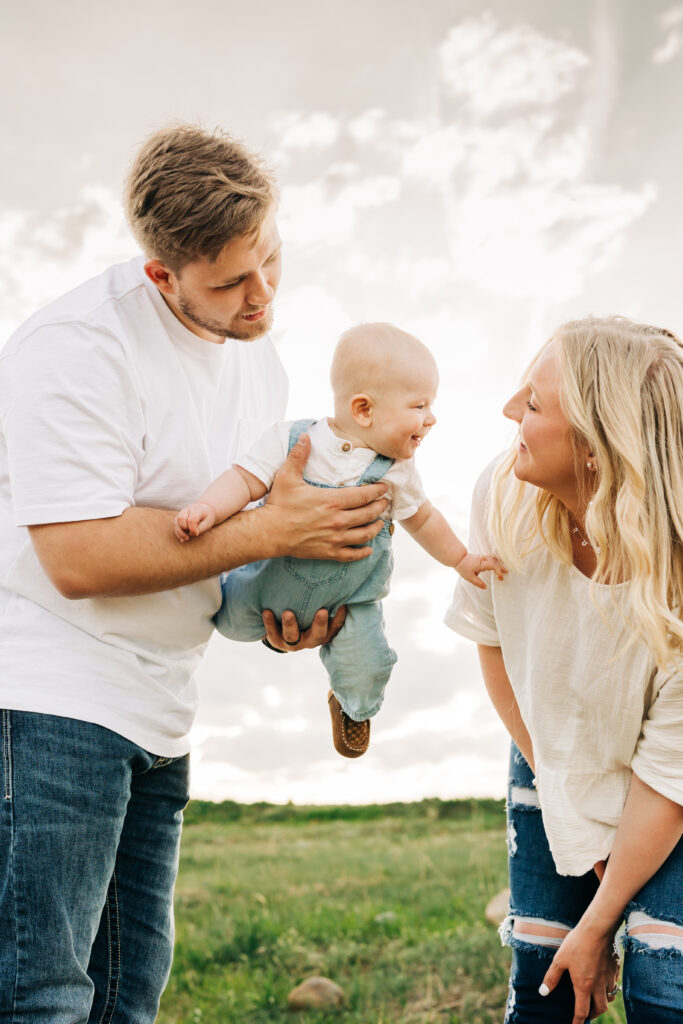 Denver Family Photographer captures mom and dad playing with baby