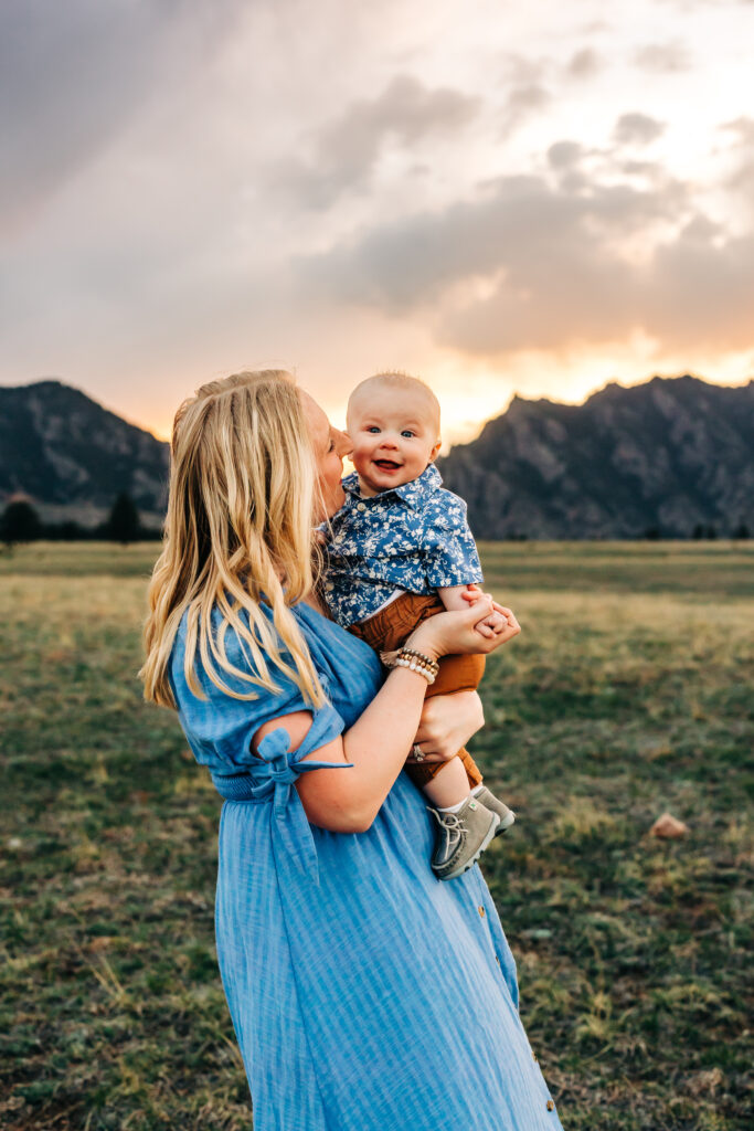 Denver Family Photographer captures mother holding child and kissing him on the cheek