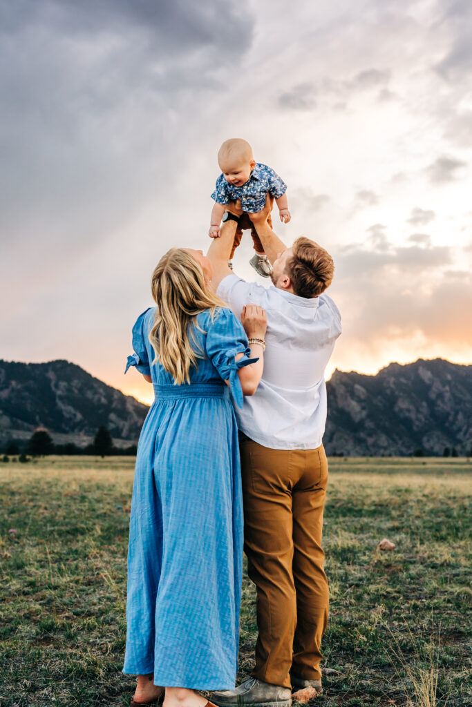 Denver Family Photographer captures father holding baby in air