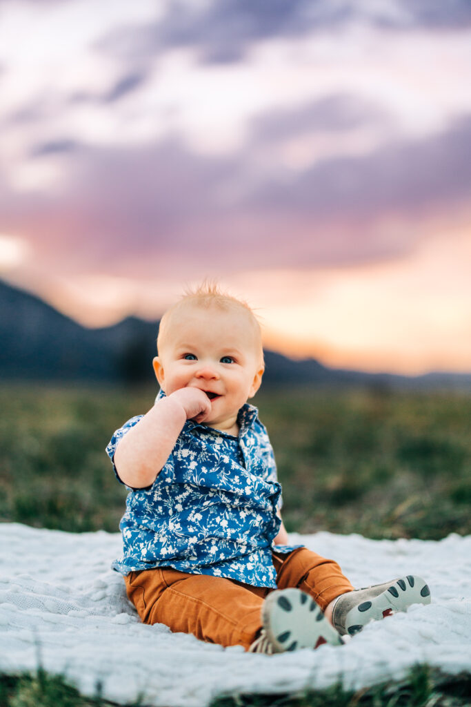 Denver Family Photographer captures baby sitting on blanket 