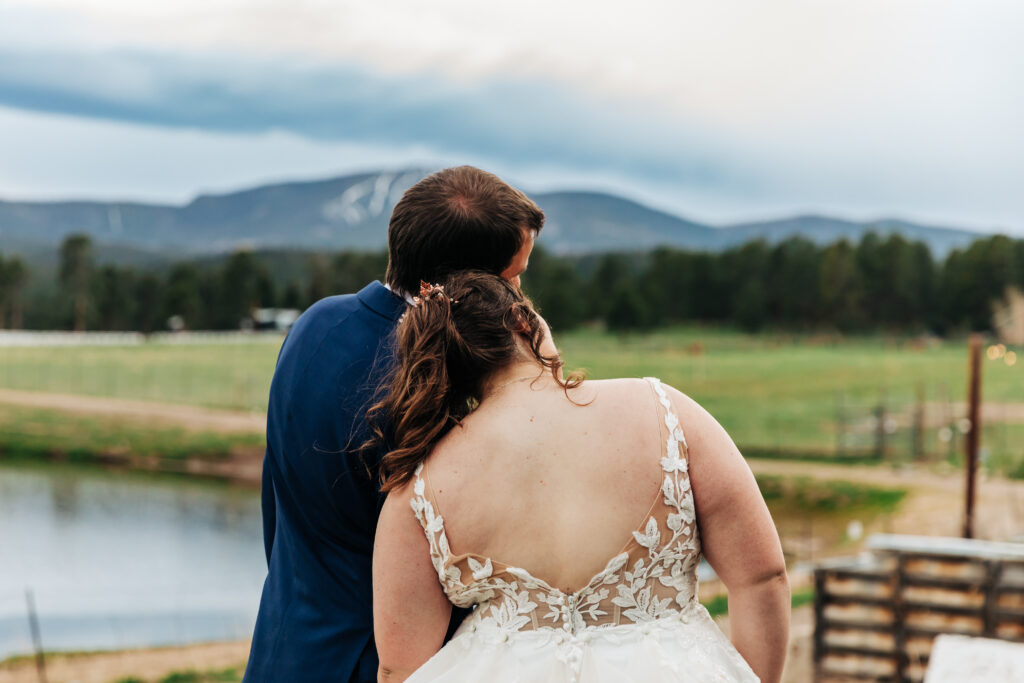 Colorado Wedding Photographer captures bride and groom looking off into distance