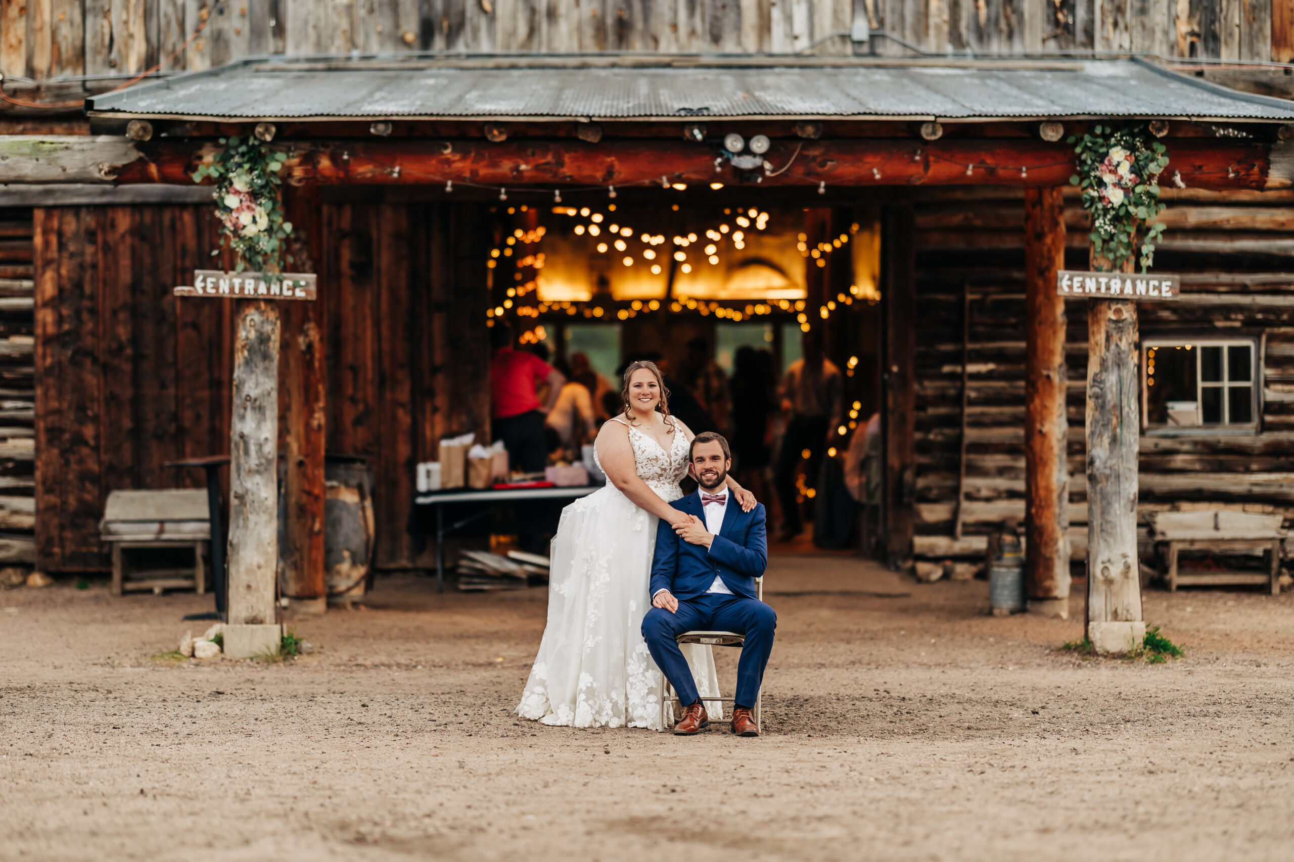 Colorado Wedding Photographer captures bride and groom sitting together during outdoor bridal portraits