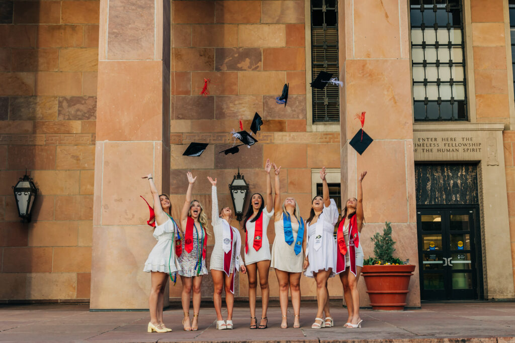 Colorado Senior Photographer captures group of friends throwing graduation caps in the air