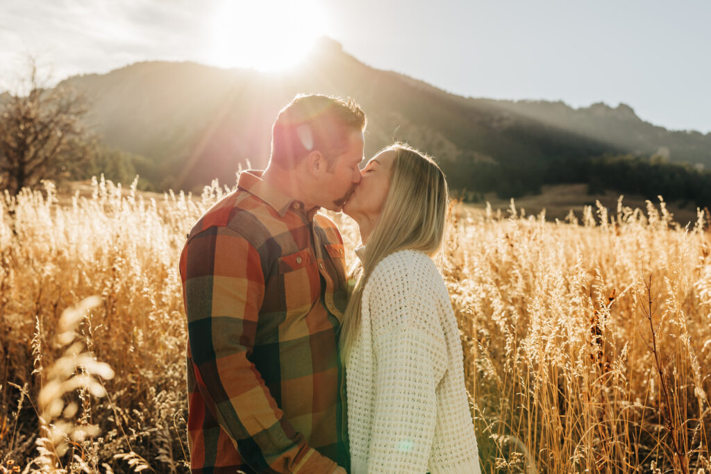 Denver wedding photographer captures couple kissing at sunset