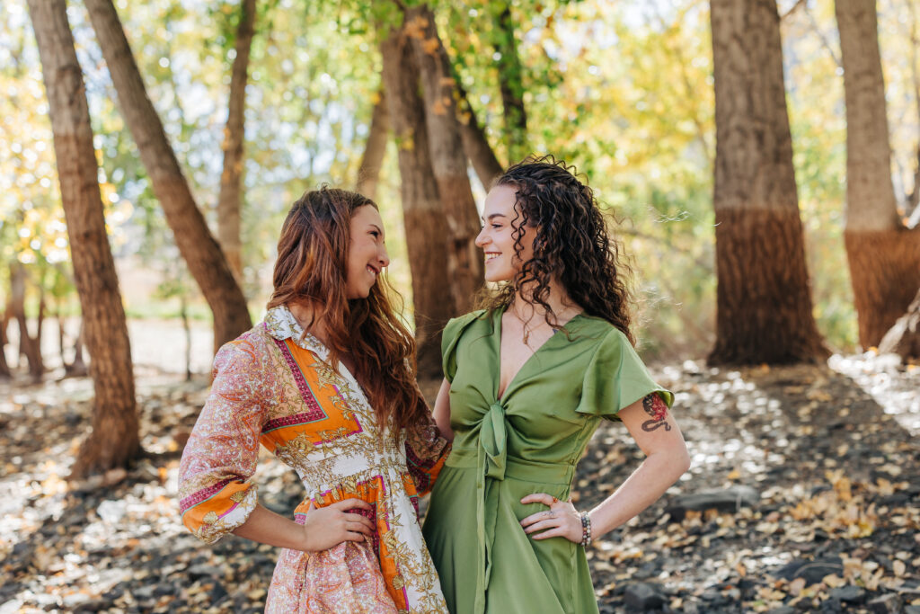 Colorado Senior Photographers capture two seniors embracing and smiling at one another