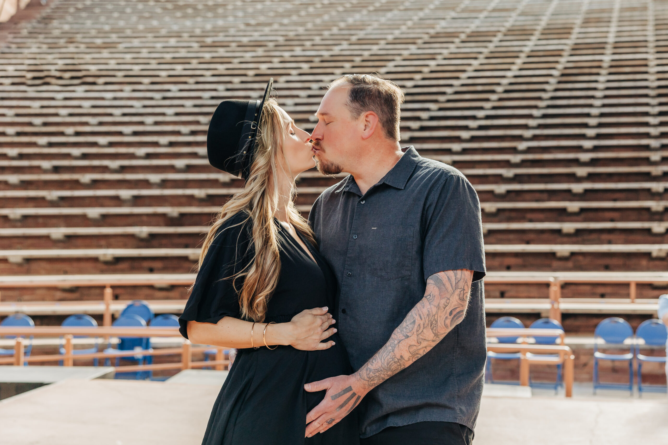 Denver Maternity Photographer captures husband kissing pregnant wife during maternity photoshoot