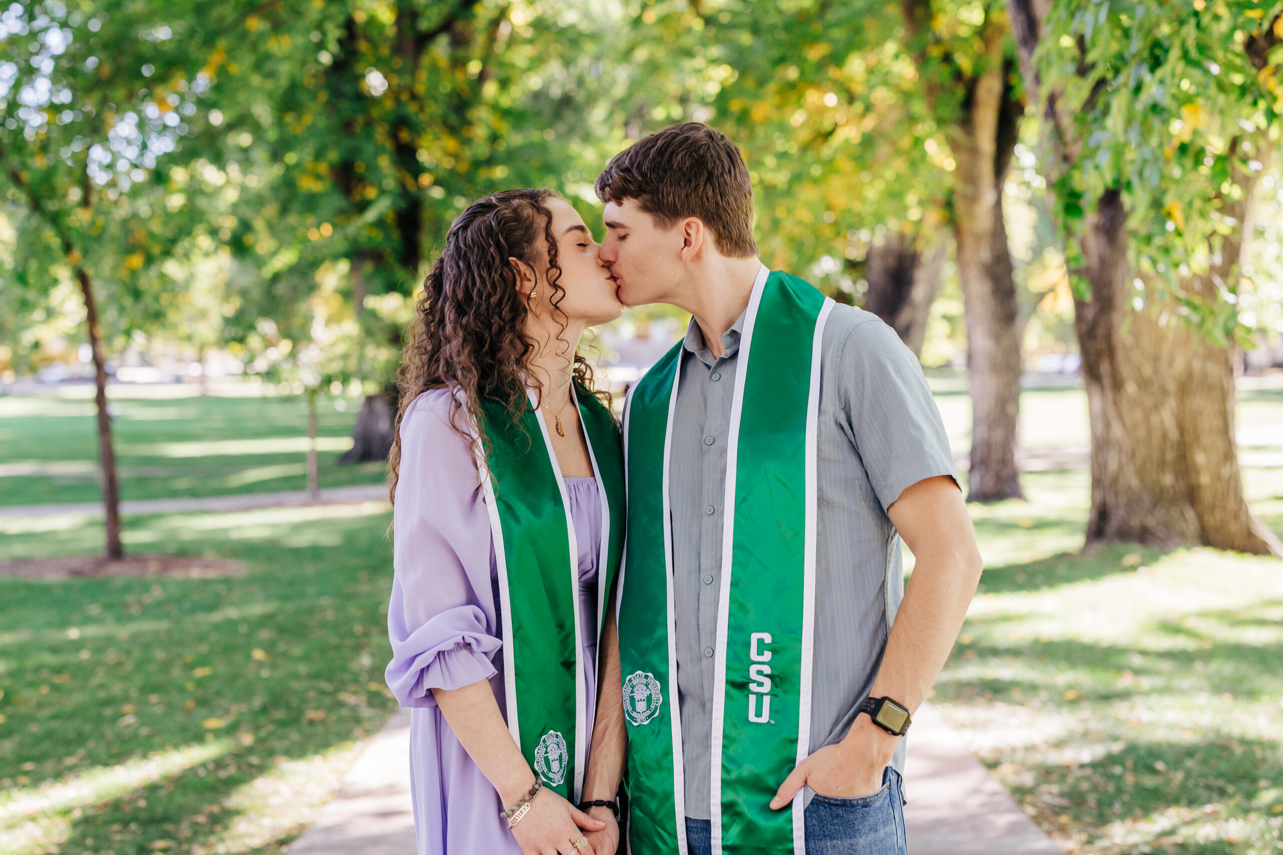 Colorado Senior Photographers capture couple kissing during graduation pictures