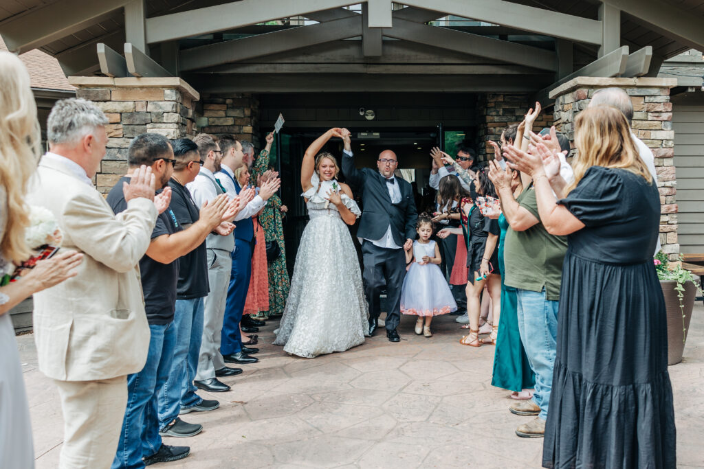 Colorado Wedding Photographer captures bride and groom during wedding send offs 