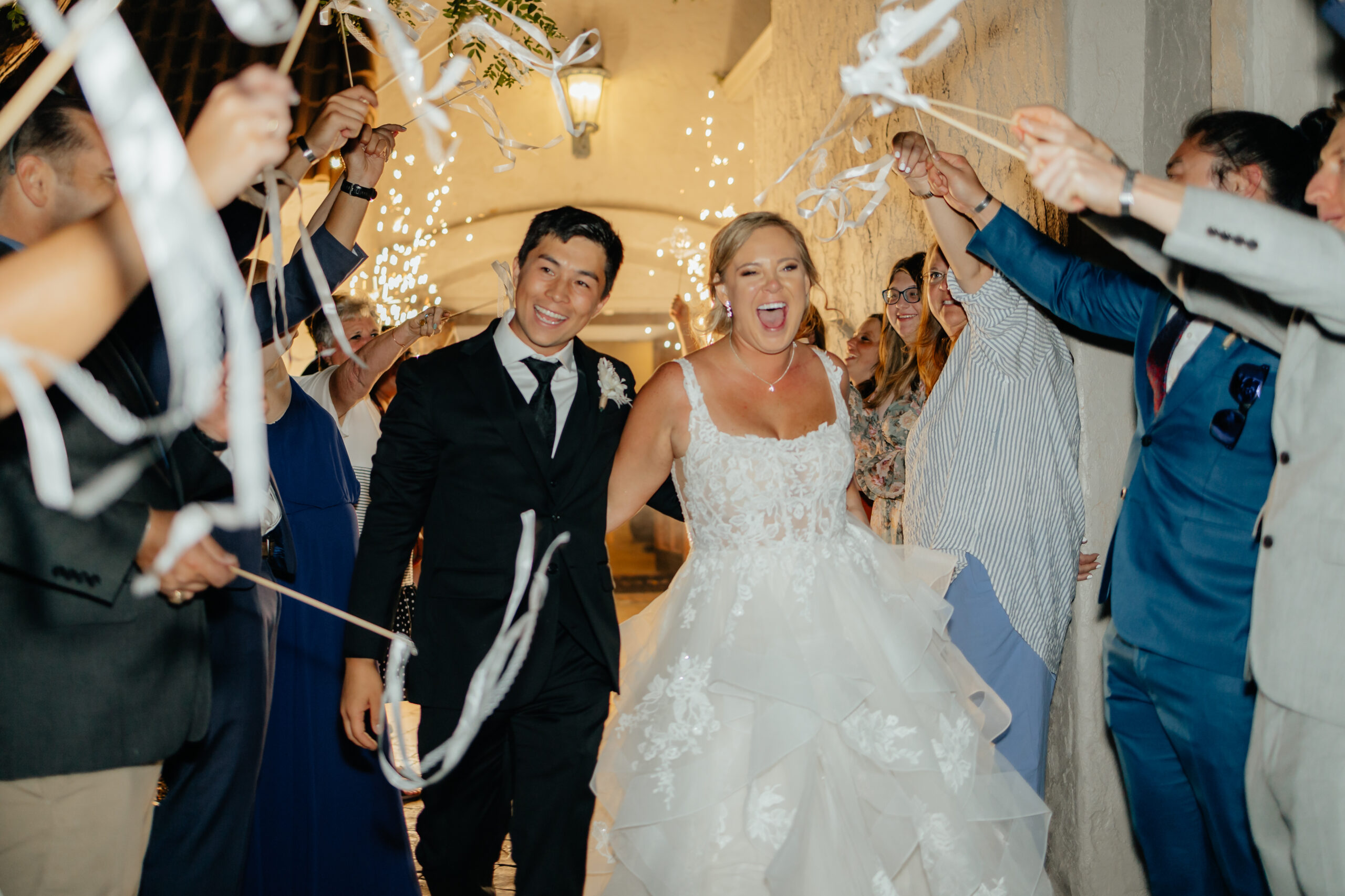 Colorado Wedding Photographer captures bride and groom leaving wedding with unique wedding send offs