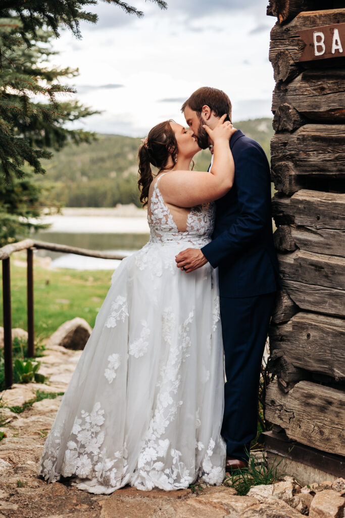 Colorado Wedding Photographer captures bride and groom kissing during bridal portraits