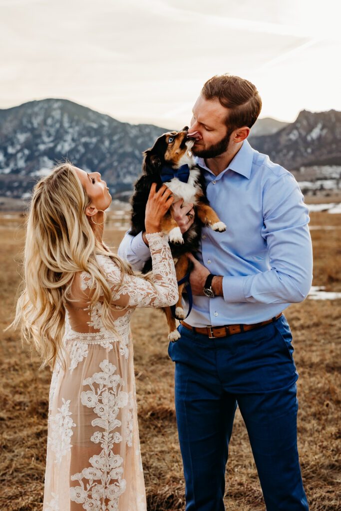 Denver wedding photographer captures couple loving on puppy during engagement photos with pets