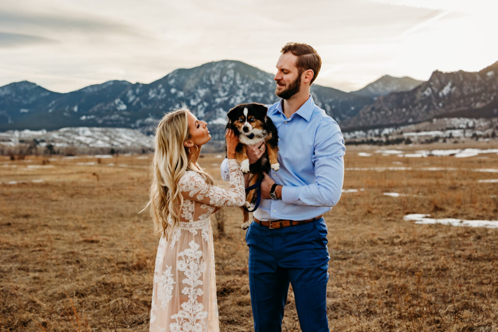 Denver wedding photographer captures man holding dog during engagement photos with pets