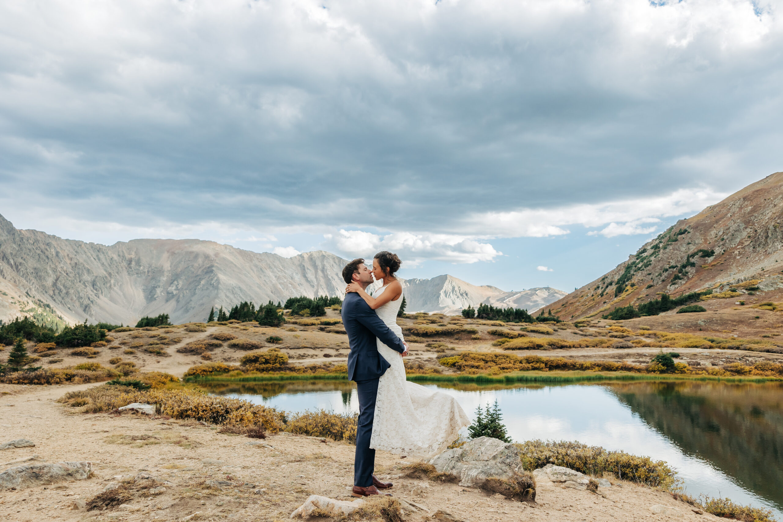 Colorado Elopement Photographer captures groom lifting bride