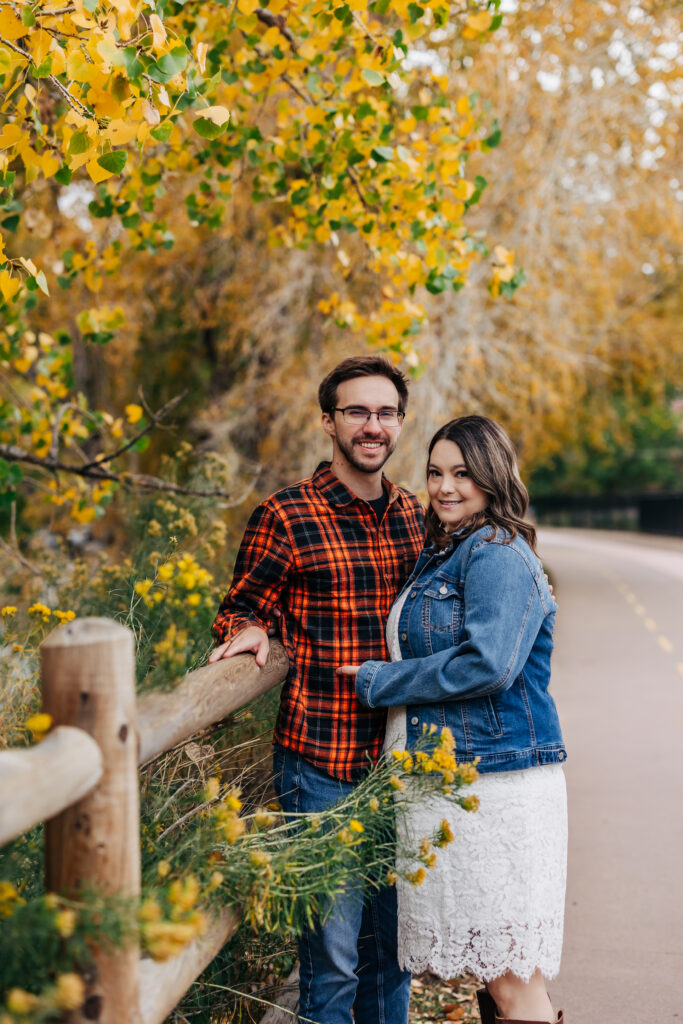 Denver Engagement Photographer captures man leaning against fence