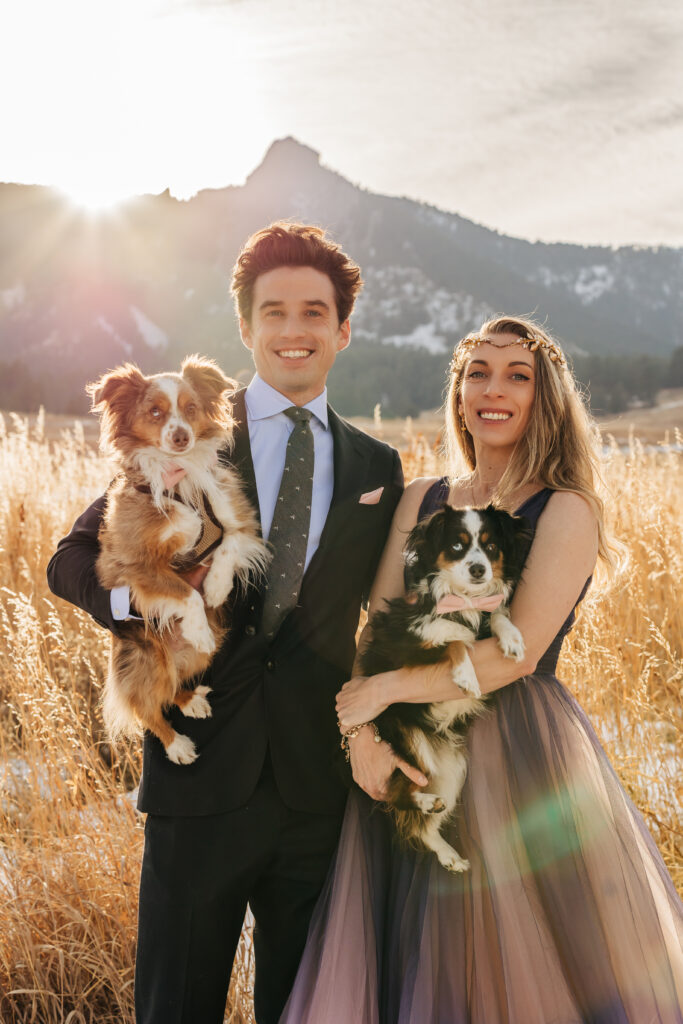 Colorado Elopement Photographer captures bride wearing purple dress holding puppy