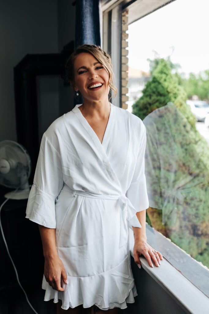 Boulder Wedding Photographer captures bride wearing white satin robe