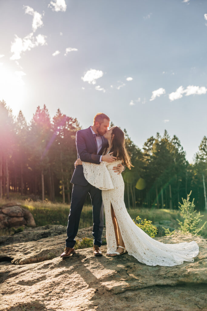 Boulder Wedding Photographer captures bride and groom kissing at golden hour