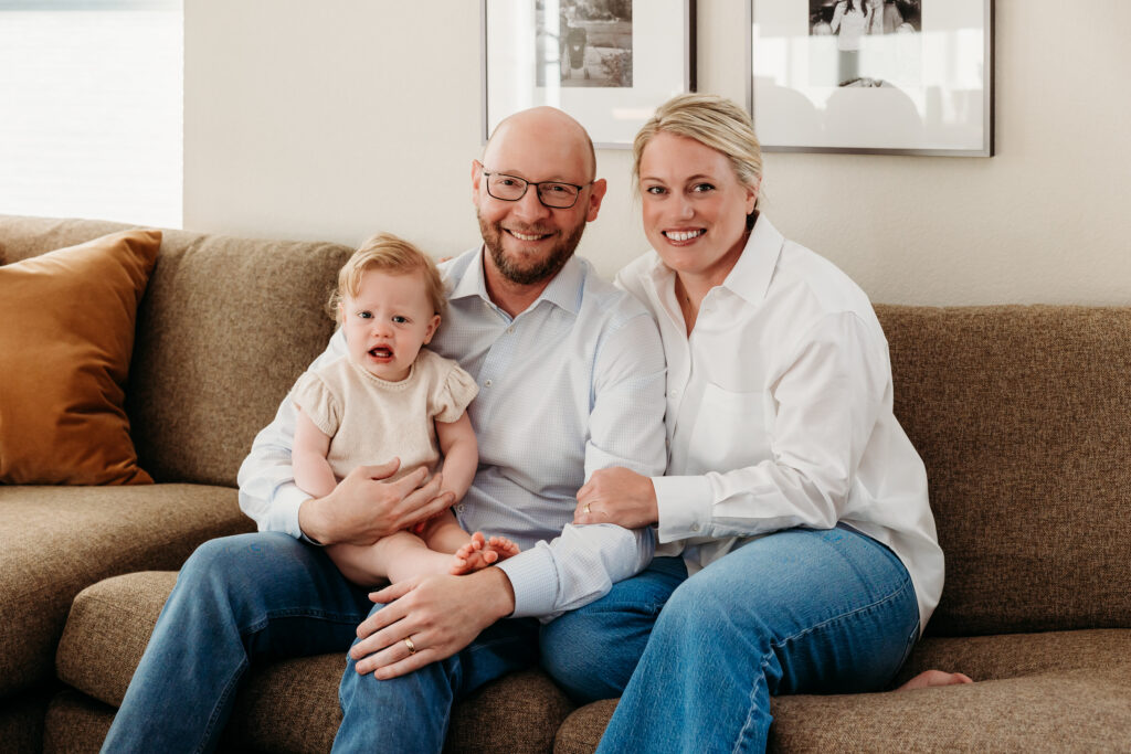 Denver Family Photographer captures in home family photos with family sitting on couch together