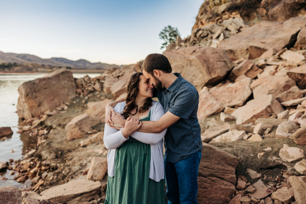 Denver Wedding Photographer captures man and woman embracing during outdoor engagement photos