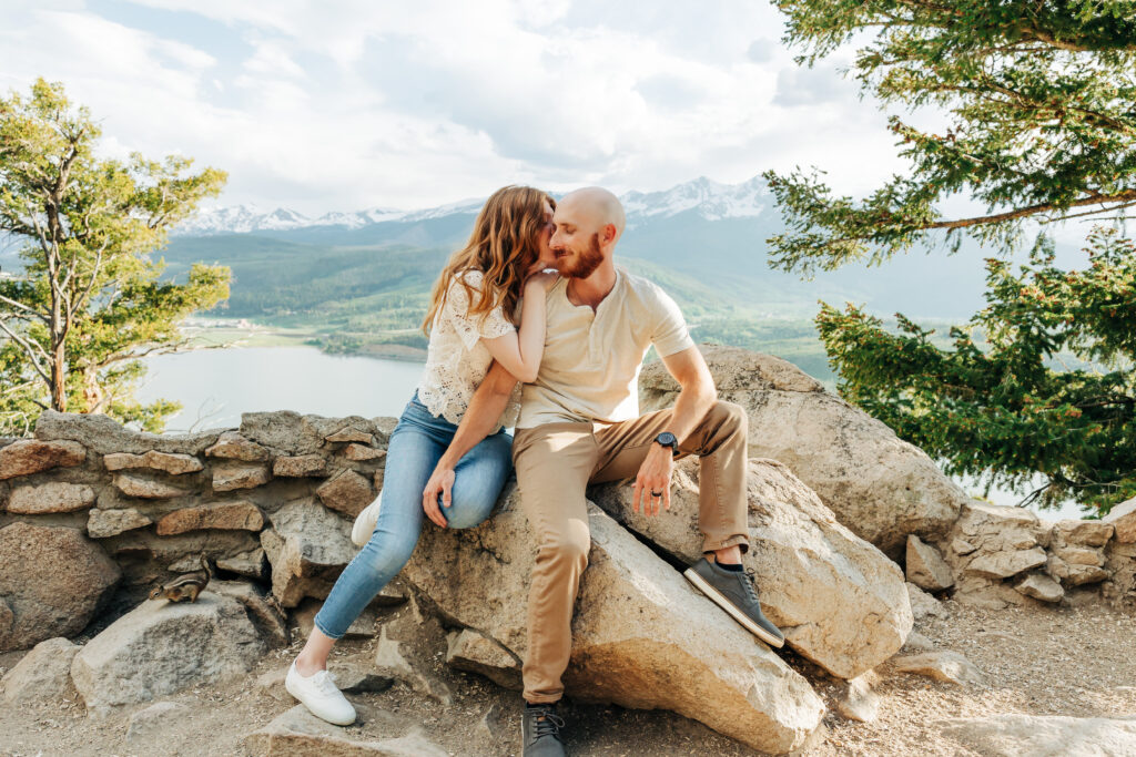 Denver Engagement Photographer captures couple embracing on boulder