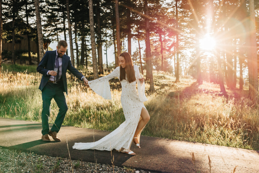 Boulder Wedding Photographer captures couple walking together at sunset