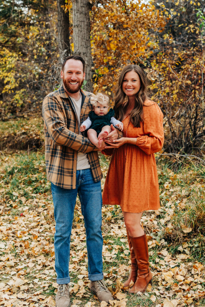 Denver Family Photographer captures family smiling with baby 