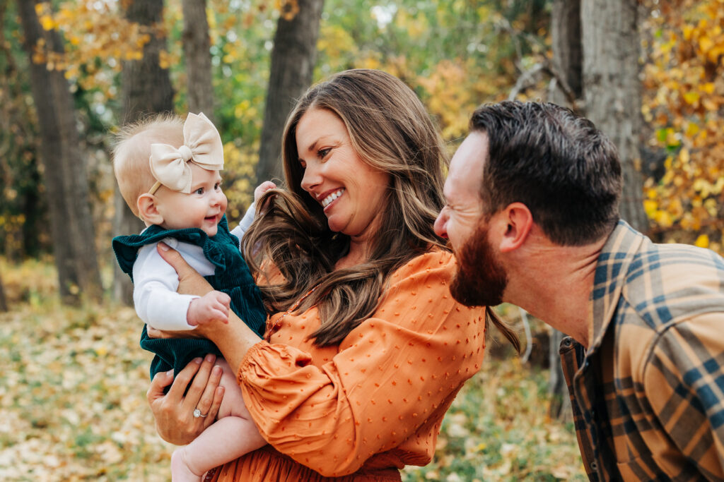 Denver Family Photographer captures mother and father playing with baby