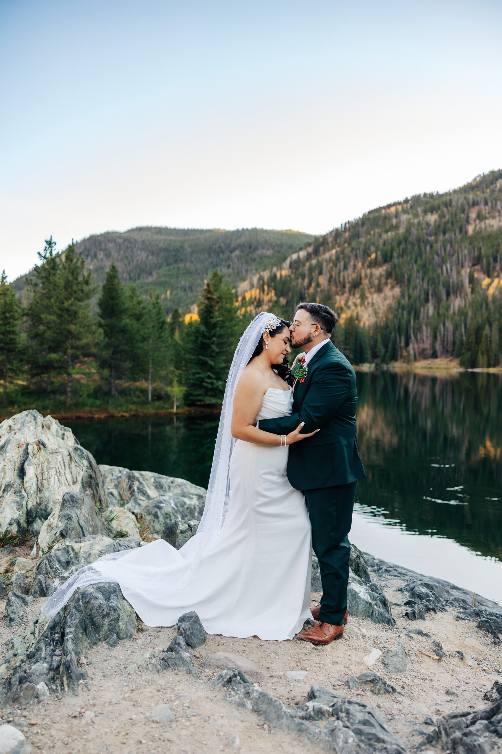 Colorado Elopement Photographer captures bride and groom on boulder together