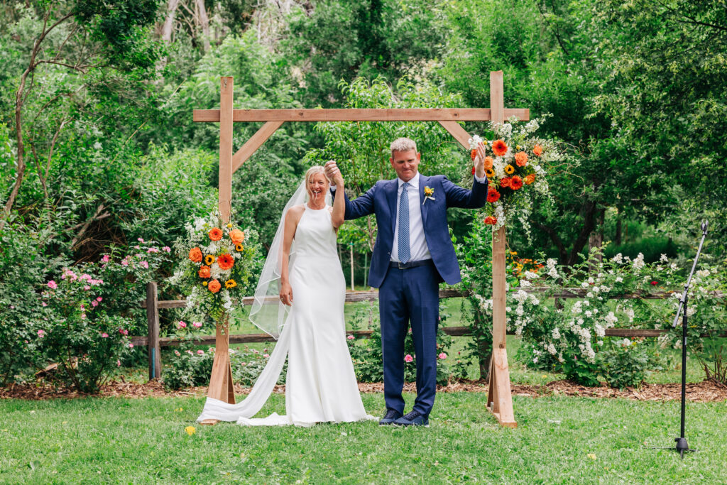 Boulder Wedding Photographer captures bride and groom celebrating after weekday wedding