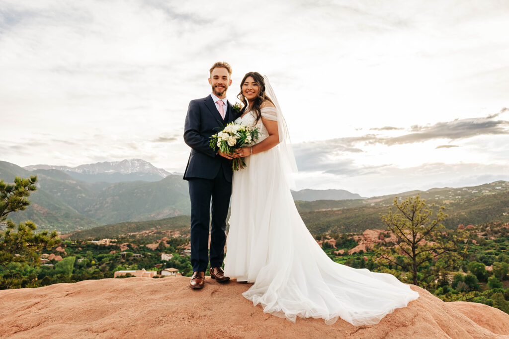 Colorado Elopement Photographer captures bride and groom embracing during outdoor bridal portraits after destination elopement ceremony