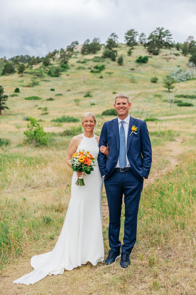 Boulder Wedding Photographer captures bride and groom standing together hand in hand