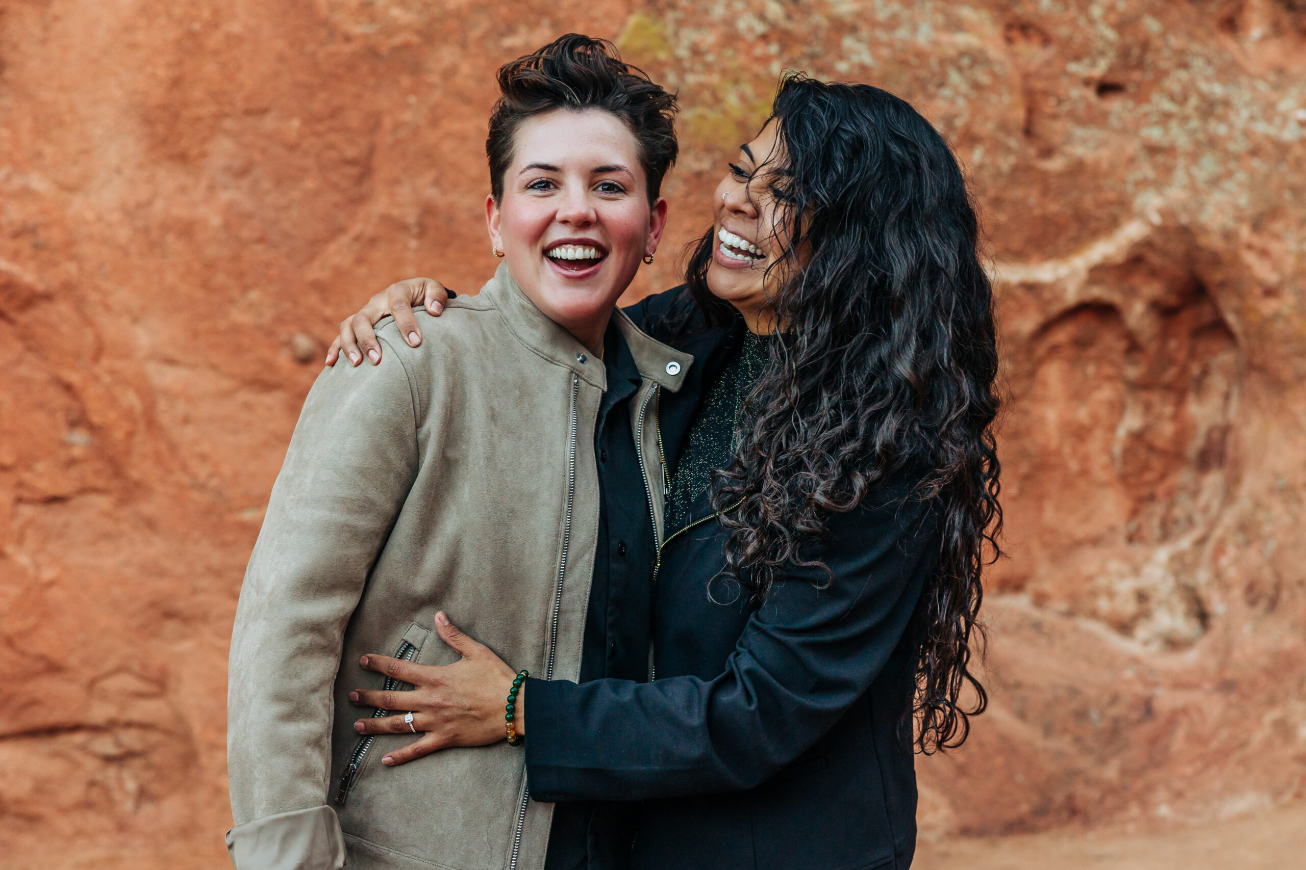 Denver Wedding Photographer captures couple laughing after surprise adventure engagement