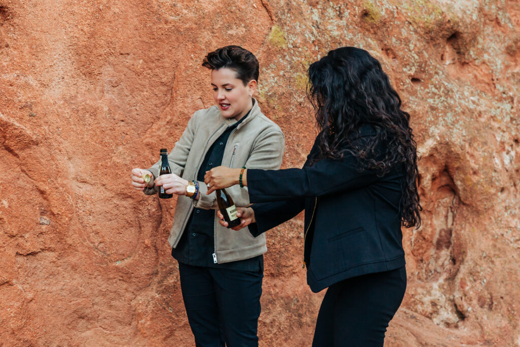 Denver Wedding Photographer captures women popping champagne together