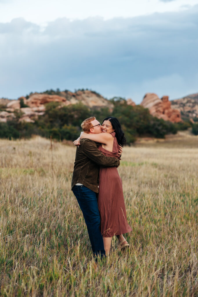 Colorado Elopement Photographer captures couple hugging during fall photos