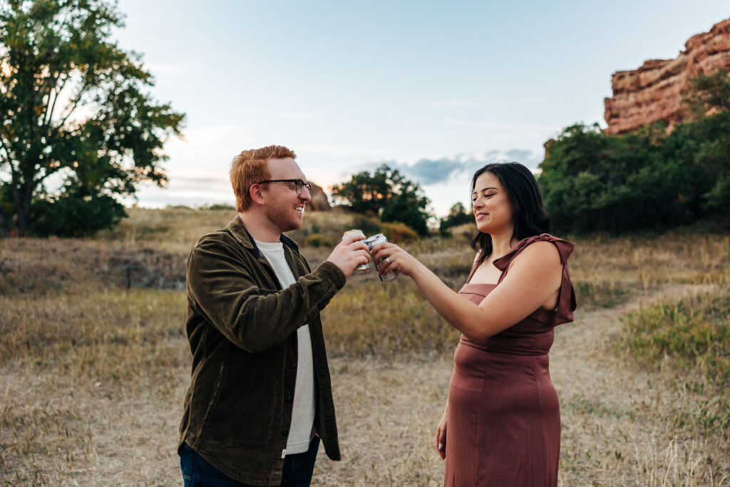 Colorado Elopement Photographer captures couple drinking beer after fall session