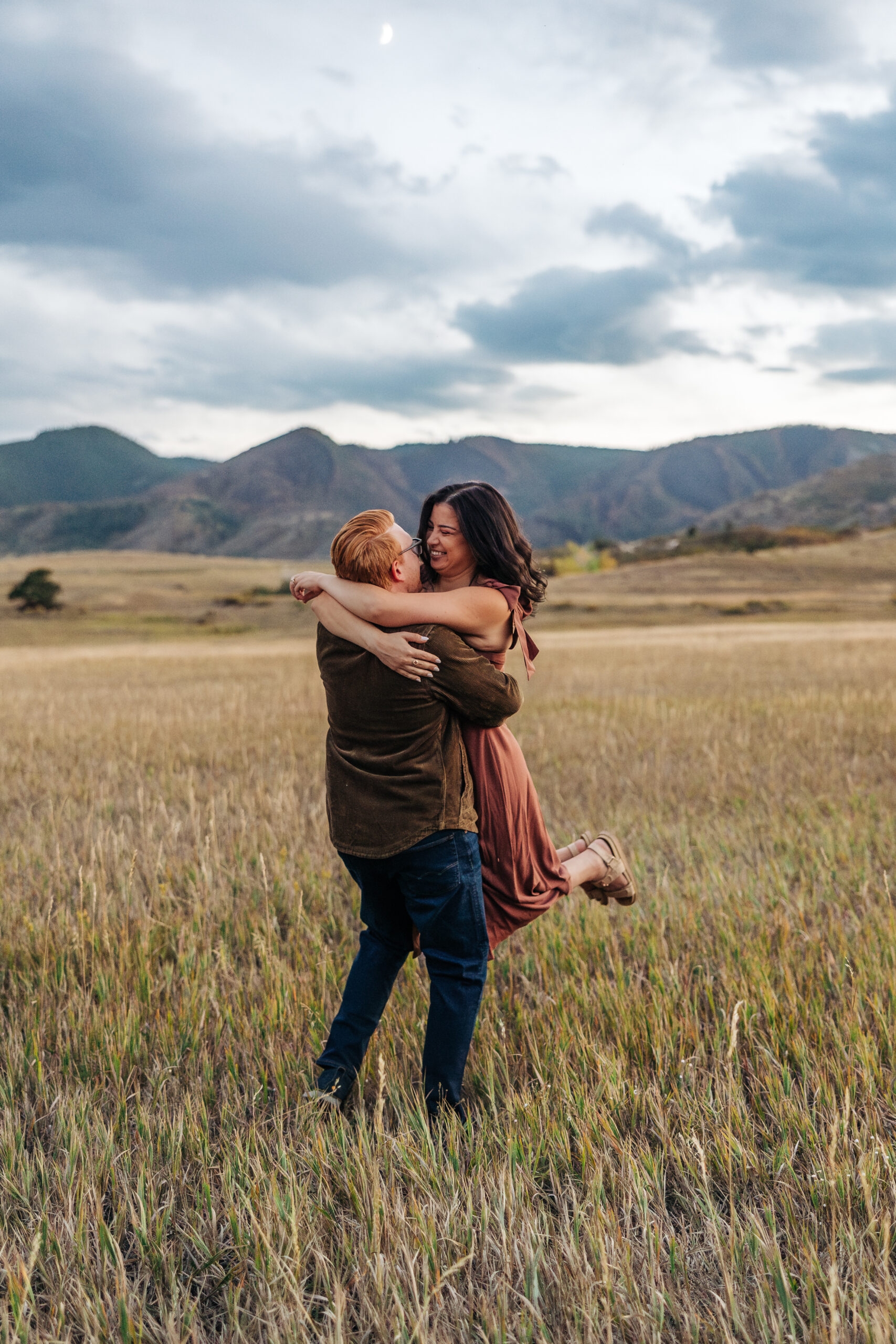 Colorado Elopement Photographer captures man lifting woman in air and spinning her