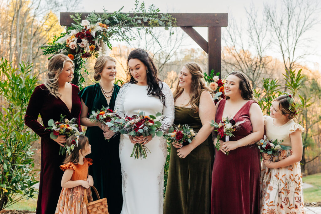 Colorado Elopement Photographer captures bride with wedding party and little flower girl